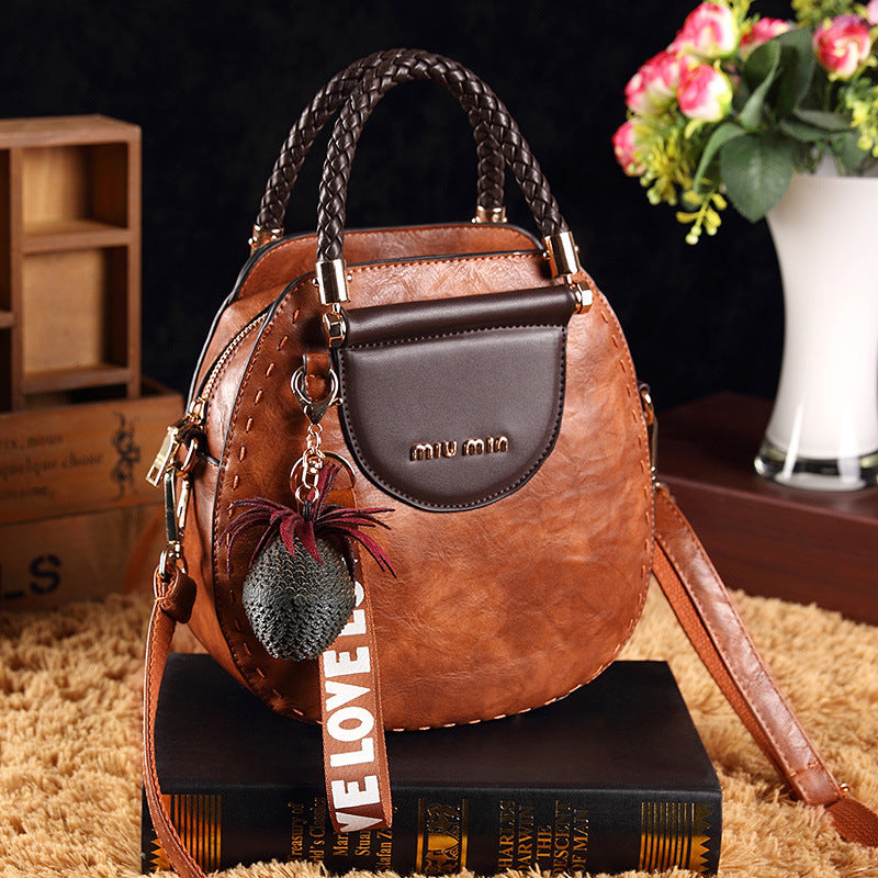 Sac Rond PU – Alliance de Style et Fonctionnalité