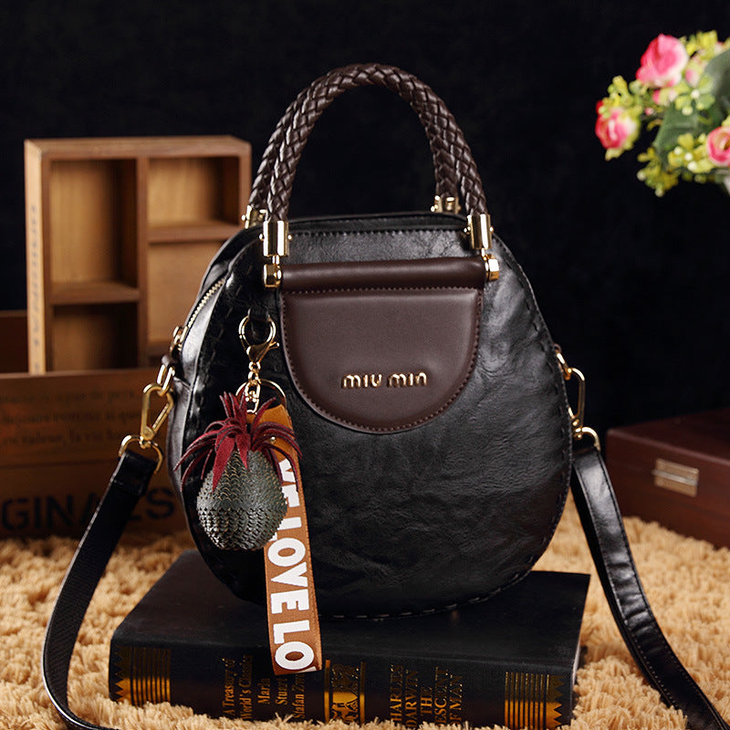 Sac Rond PU – Alliance de Style et Fonctionnalité